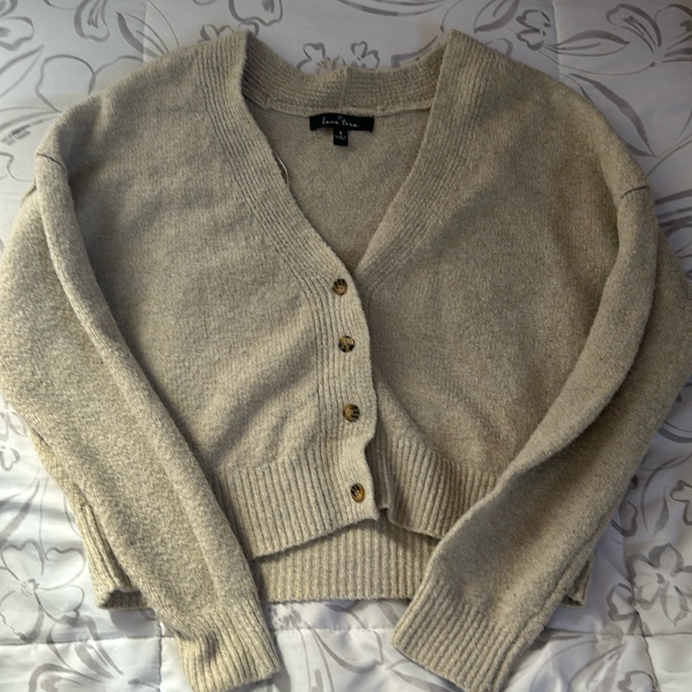 cropped button-up cream sweater. got it at tj-maxx one month ago.